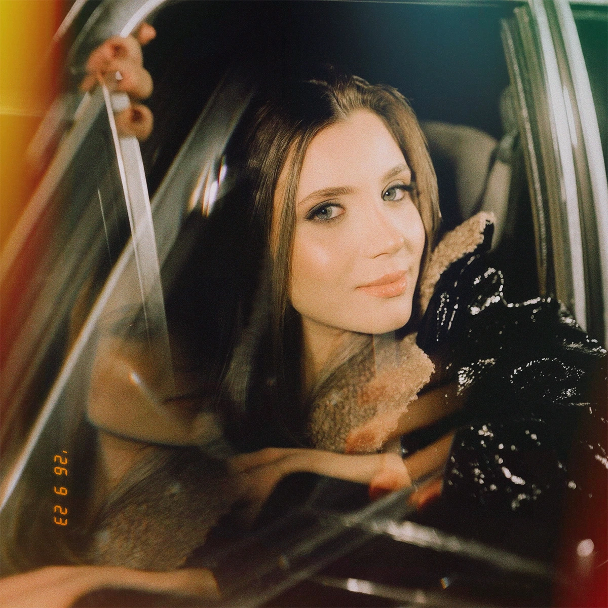 Create an analog portrait with film color grain and glow
